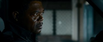 Movie still from “Cleaner” (2007), directed by Renny Harlin – A man's face in front of a window; Close Up shot, Over the shoulder angle