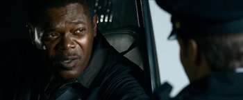 Movie still from “Cleaner” (2007), directed by Renny Harlin – A person sitting in a car; Close Up shot, Over the shoulder angle