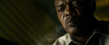 Movie still from “Cleaner” (2007), directed by Renny Harlin – A person wearing a suit and tie; Close Up shot, Low angle