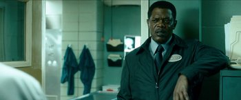 Movie still from “Cleaner” (2007), directed by Renny Harlin – A man standing in front of a sink in a bathroom; Close Up shot, Over the shoulder angle