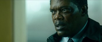 Movie still from “Cleaner” (2007), directed by Renny Harlin – A person wearing a suit and tie; Close Up shot, Low angle