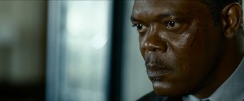 Movie still from “Cleaner” (2007), directed by Renny Harlin – A man's face in front of a window; Close Up shot, Over the shoulder angle