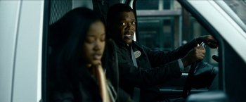 Movie still from “Cleaner” (2007), directed by Renny Harlin – A man and a woman sitting in a car; Close Up shot, Over the shoulder angle