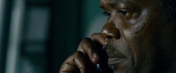 Movie still from “Cleaner” (2007), directed by Renny Harlin – A person talking on a cell phone; Extreme Close Up shot, Low angle
