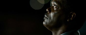 Movie still from “Cleaner” (2007), directed by Renny Harlin – A person looking up at the sky; Extreme Close Up shot, Low angle