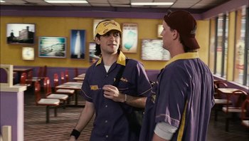 Movie still from “Clerks II” (2006), directed by Kevin Smith – Two men talking to each other in a fast food restaurant; Medium shot, Over the shoulder angle