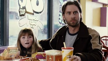 Movie still from “Clerks II” (2006), directed by Kevin Smith – A man and a little girl sitting at a table; Close Up shot, Over the shoulder angle
