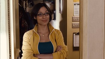 Movie still from “Clerks II” (2006), directed by Kevin Smith – A young woman with glasses and a yellow jacket; Close Up shot, Over the shoulder angle