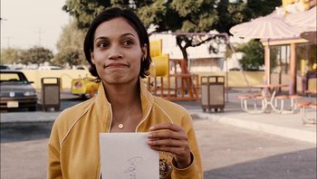 Movie still from “Clerks II” (2006), directed by Kevin Smith – A woman holding a piece of paper in her hand; Close Up shot, Over the shoulder angle
