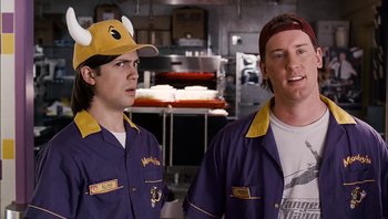 Movie still from “Clerks II” (2006), directed by Kevin Smith – A couple of men standing next to each other in a kitchen; Close Up shot, Over the shoulder angle