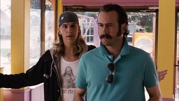 Movie still from “Clerks II” (2006), directed by Kevin Smith – A man and a woman standing next to each other in front of a building; Close Up shot, Low angle