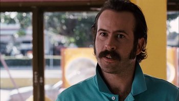 Movie still from “Clerks II” (2006), directed by Kevin Smith – A person with a mustache; Close Up shot, Low angle