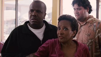 Movie still from “Clerks II” (2006), directed by Kevin Smith – A man and a woman looking at a camera; Close Up shot, Over the shoulder angle