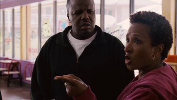 Movie still from “Clerks II” (2006), directed by Kevin Smith – A man and a woman talking to each other; Close Up shot, Over the shoulder angle