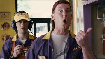 Movie still from “Clerks II” (2006), directed by Kevin Smith – A man with a surprised look on his face; Medium shot, Low angle