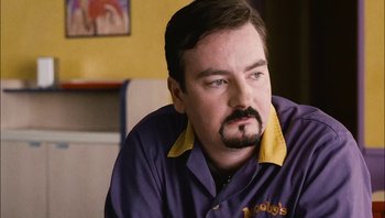Movie still from “Clerks II” (2006), directed by Kevin Smith – A person with a mustache; Close Up shot, Over the shoulder angle