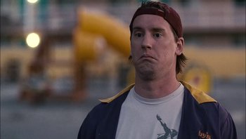 Movie still from “Clerks II” (2006), directed by Kevin Smith – A person wearing a headband; Close Up shot, Low angle