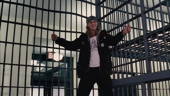 Movie still from “Clerks II” (2006), directed by Kevin Smith – A man standing in front of a jail cell; Medium shot, Low angle