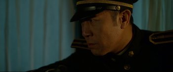 Movie still from “Cliff Walkers” (2021), directed by Yimou Zhang – A person wearing a uniform; Close Up shot, Low angle