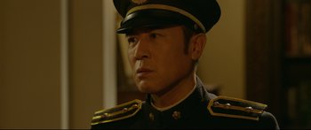 Movie still from “Cliff Walkers” (2021), directed by Yimou Zhang – A person wearing a uniform; Close Up shot, Over the shoulder angle