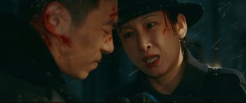 Movie still from “Cliff Walkers” (2021), directed by Yimou Zhang – A man and a woman are looking at each other; Close Up shot, Over the shoulder angle