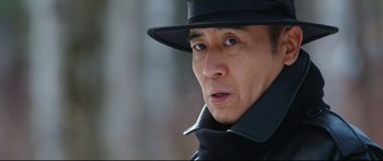 Movie still from “Cliff Walkers” (2021), directed by Yimou Zhang – A person wearing a hat; Close Up shot, Low angle