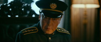 Movie still from “Cliff Walkers” (2021), directed by Yimou Zhang – An older man wearing a military uniform and a hat; Close Up shot, Low angle