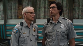 Movie still from “The Dead Don't Die” (2019), directed by Jim Jarmusch – A man and an older man standing next to each other; Close Up shot, Low angle