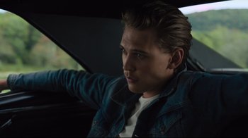 Movie still from “The Dead Don't Die” (2019), directed by Jim Jarmusch – A man sitting in the driver's seat of a car; Close Up shot, Over the shoulder angle