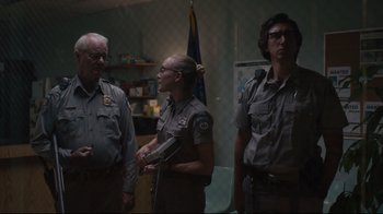 Movie still from “The Dead Don't Die” (2019), directed by Jim Jarmusch – A group of people standing next to each other; Medium shot, Over the shoulder angle