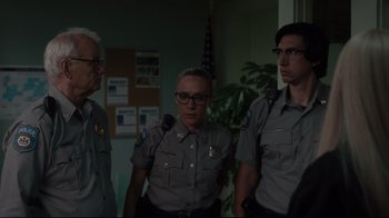 Movie still from “The Dead Don't Die” (2019), directed by Jim Jarmusch – A group of police officers standing next to each other; Medium shot, Over the shoulder angle