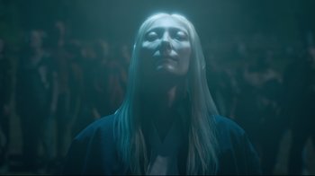 Movie still from “The Dead Don't Die” (2019), directed by Jim Jarmusch – A woman with her eyes closed in a dark room; Close Up shot, Low angle