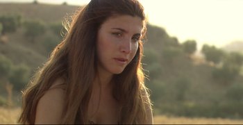 Movie still from “Climates” (2006), directed by Nuri Bilge Ceylan – A beautiful young woman with long brown hair and no make - up; Close Up shot, Over the shoulder angle