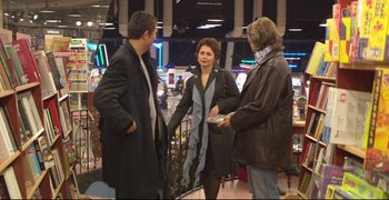Movie still from “Climates” (2006), directed by Nuri Bilge Ceylan – A group of people standing around talking to each other; Wide shot, Over the shoulder angle