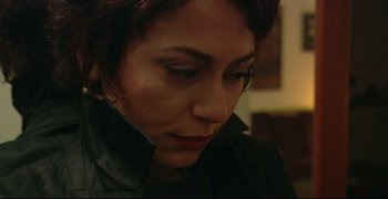Movie still from “Climates” (2006), directed by Nuri Bilge Ceylan – A person with short hair; Close Up shot, High angle