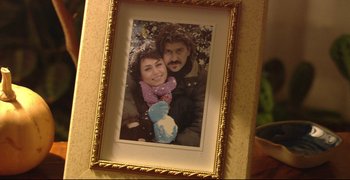 Movie still from “Climates” (2006), directed by Nuri Bilge Ceylan – A picture of a man and a woman in a picture frame; Extreme Close Up shot, High angle