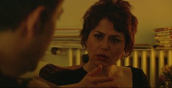 Movie still from “Climates” (2006), directed by Nuri Bilge Ceylan – A woman looking at a man in the mirror; Close Up shot, Over the shoulder angle