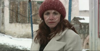 Movie still from “Climates” (2006), directed by Nuri Bilge Ceylan – A woman wearing a red hat and a white coat; Close Up shot, Low angle