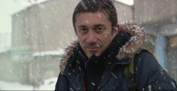 Movie still from “Climates” (2006), directed by Nuri Bilge Ceylan – A person wearing a jacket; Close Up shot, Low angle