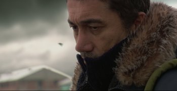 Movie still from “Climates” (2006), directed by Nuri Bilge Ceylan – A person wearing a jacket; Close Up shot, Low angle