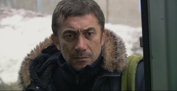 Movie still from “Climates” (2006), directed by Nuri Bilge Ceylan – A person wearing a jacket; Close Up shot, Over the shoulder angle