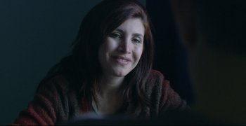 Movie still from “Climates” (2006), directed by Nuri Bilge Ceylan – A person sitting in front of a window; Close Up shot, Over the shoulder angle