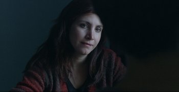 Movie still from “Climates” (2006), directed by Nuri Bilge Ceylan – A person with long brown hair; Close Up shot, Over the shoulder angle