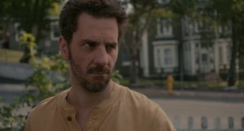 Movie still from “Closet Monster” (2015), directed by Stephen Dunn – A person wearing a yellow shirt; Close Up shot, Over the shoulder angle