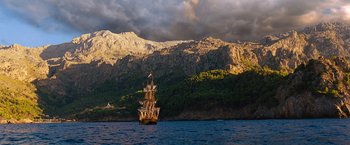 Movie still from “Cloud Atlas” (2012), directed by Lilly Wachowski – A boat in the water near the mountains; Extreme Wide shot, Low angle