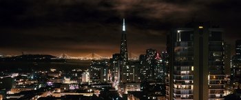 Movie still from “Cloud Atlas” (2012), directed by Lilly Wachowski – A view of a city skyline at night with lights on; Extreme Wide shot, High angle