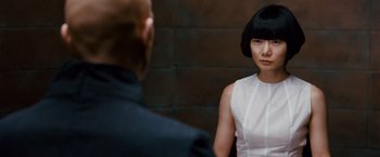 Movie still from “Cloud Atlas” (2012), directed by Lilly Wachowski – A woman in a white dress is looking at a man in a black suit; Close Up shot, Over the shoulder angle