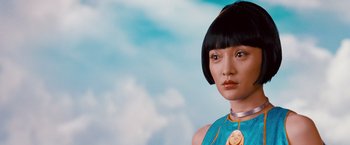 Movie still from “Cloud Atlas” (2012), directed by Lilly Wachowski – A person with short black hair; Close Up shot, Low angle