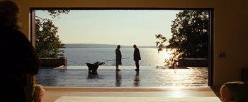 Movie still from “Cloud Atlas” (2012), directed by Lilly Wachowski – Two people standing on a dock with a baby carriage; Extreme Wide shot, Over the shoulder angle