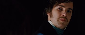 Movie still from “Cloud Atlas” (2012), directed by Lilly Wachowski – A man's face in the dark; Close Up shot, Overhead angle